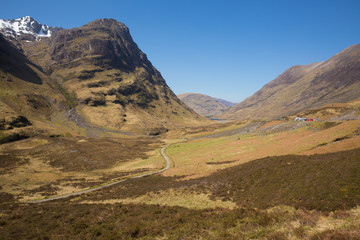 Glencoe Valley Scotland UK famous Scottish glen with mountains in Scottish Highlands in spring a tourist destination with blue sky and sunshine