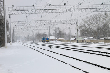View on the snowy railroad tracks on winter