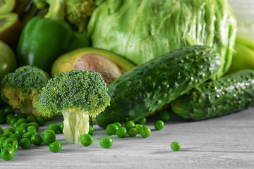 Green vegetables on wooden background