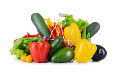 Group of fresh vegetables in basket on white background