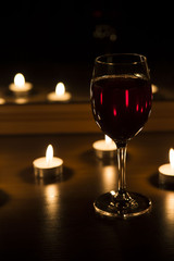 candles and a glass of wine home evening