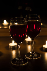 candles and a glass of wine home evening