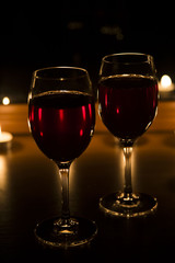 candles and a glass of wine home evening