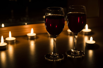 candles and a glass of wine home evening
