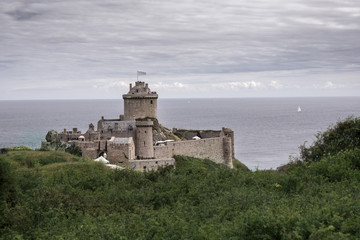 Fototapeta na wymiar Castle on a coastal mountain