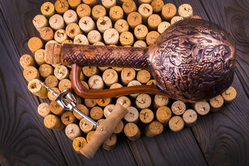 Fototapeta na wymiar bottle of wine with corks on wooden table background