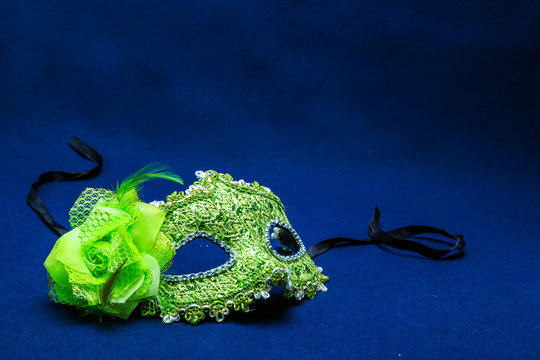 Theatrical face pack against a dark background