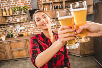 Woman toasting with beer