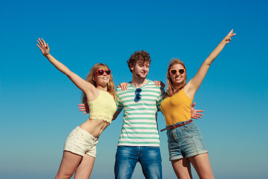 Group friends boy two girls having fun outdoor
