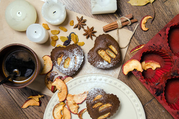 Cupcakes and decorations on wooden table