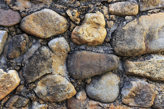 Stone wall background. over light