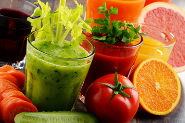 Glasses with fresh organic vegetable and fruit juices