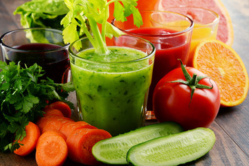 Glasses with fresh organic vegetable and fruit juices