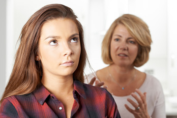 Bored Teenage Girl Being Told Off By Mother