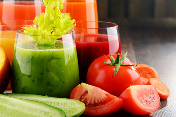 Glasses with fresh organic vegetable and fruit juices