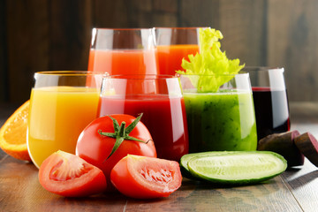 Glasses with fresh organic vegetable and fruit juices