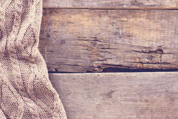 knitted plaid, sweater on old wooden boards - 133634297