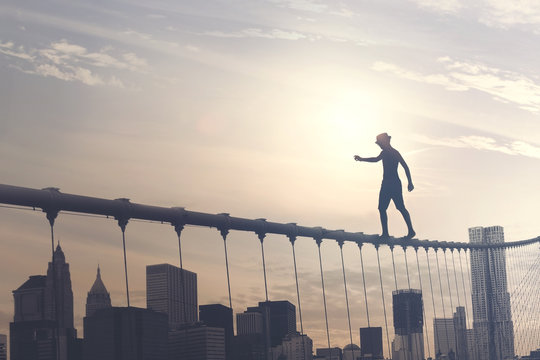 brave boy walking on a wire above the metropolis, conceptual image