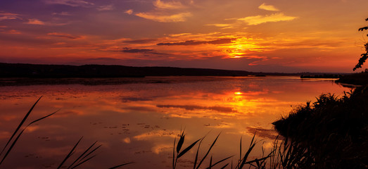 majestic landscape with sunset on lake