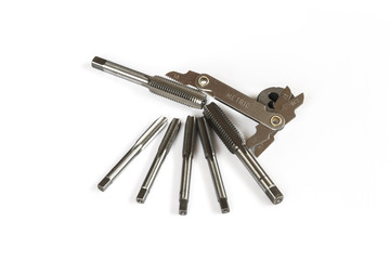 Hand tap (threading tool) with thread gauge isolated on white background.