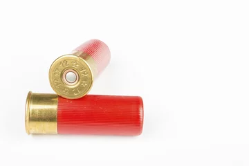Poster 12 gauge red hunting cartridges for shotgun. Macro shot. © kolidzei
