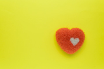 wool heart on a yellow background