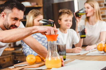 Man makes orange juice