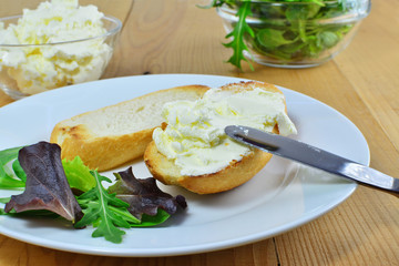 Honey-vanilla mascarpone spread on toast topped with fresh greens