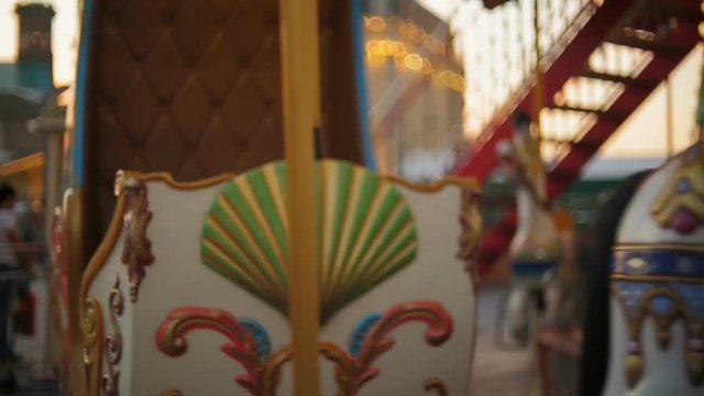 Beautiful colorful vintage carousel at amusement park