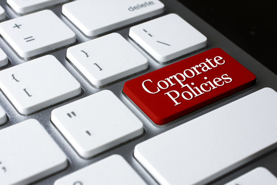 Corporate Policies On Red Enter Button On White Keyboard