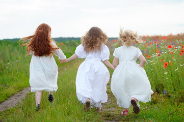 three girls running together joined hands