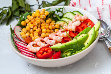 Healthy green salad with avocado and shrimp. Love for a healthy food concept