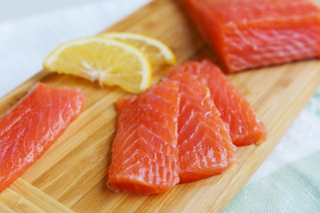 Fish, salmon, halibut and lemon closeup