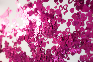 Confetti hearts on a white background,