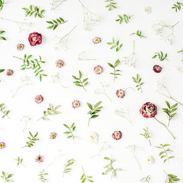 Floral texture. Pink roses and green leaves on white background. Flat lay, top view