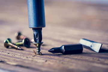 screw with a screwdriver