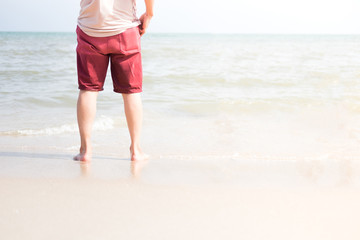 leg of man stand on the beach