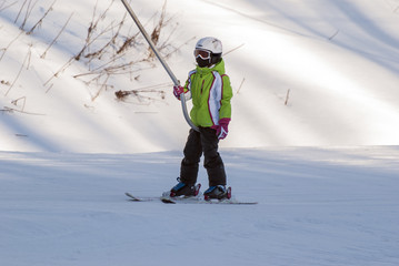The young skier on the elevator