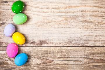 Easter eggs on old wooden board