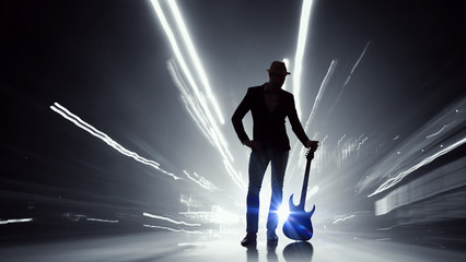 Elegant guitarist silhouette . Mixed media