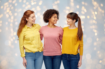 international group of happy women over lights