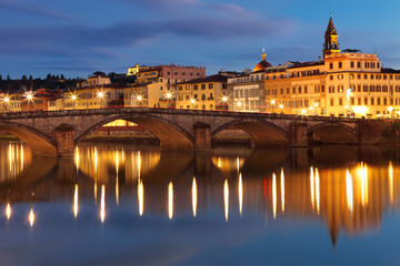 Fototapeta na wymiar By night beautiful view of bridge Carraia crossing Arno river, Firenze, Tuscany, Italy