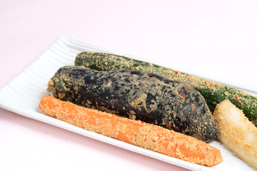 Cucumber, eggplant, carrot and radish pickled in rice bran on white background