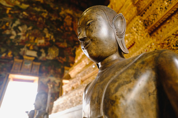 close up face on buddha head statue with lighting effect.  Selective focus face buddha statue.