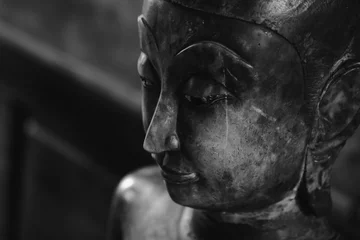 Papier Peint photo Lavable Bouddha close up face on buddha head statue and black and white image style. Selective focus face buddha statue.
