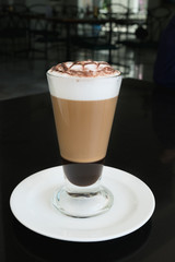 Side view of coffe mocha on black table