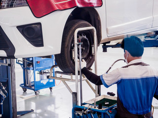 Fototapeta premium Auto mechanic working in car service centre
