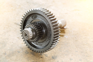 Automobile gear isolated on concrete floor.