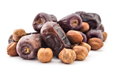 Bunc of date palm and hazelnuts, dried dates isolated on white background