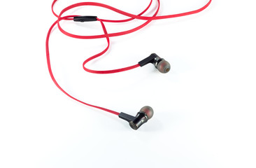 Old red earphones isolated